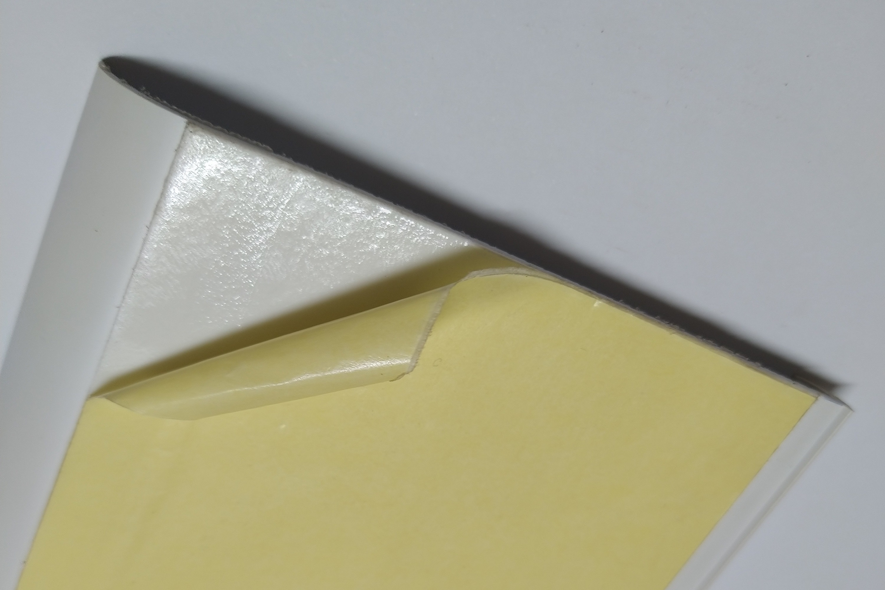 Plastic profile with adhesive tape